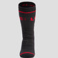 A black LOC merino wool sock with red accents and the brand name 'LOC' in red letters across the cuff.