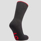 A black merino wool sock with red trim at the top edge, displaying the LOC brand logo under the sole.